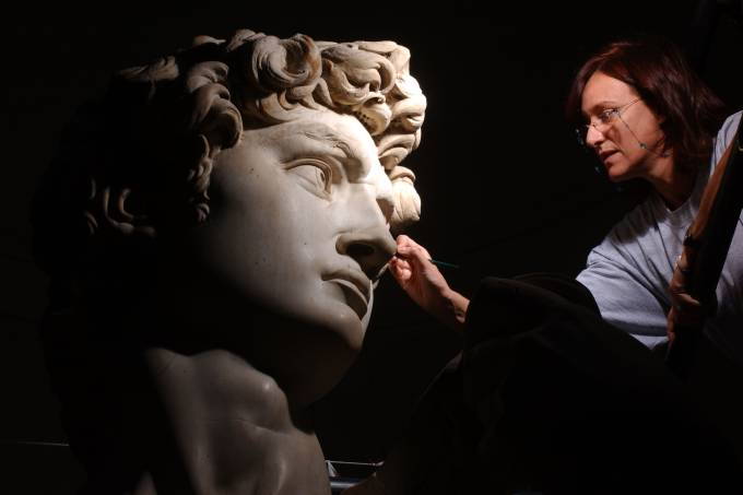 Accademia Gallery worker carefully works to restore Michelangelo's 