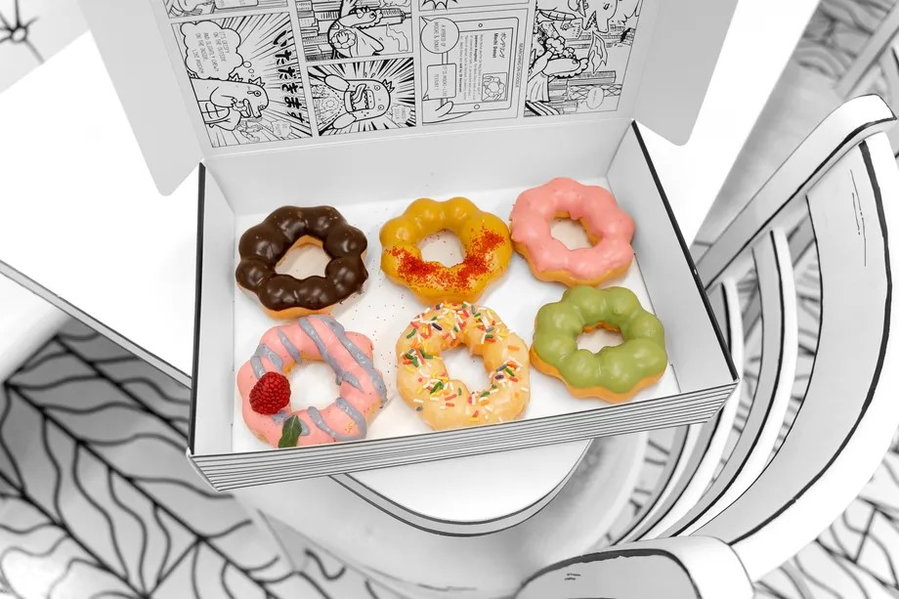 Doughnuts from Chicago's 2D Café pop out of their black-and-white cartoon packaging.