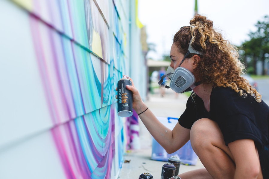 London-based street artist Rosie Woods hard at work on one of her gorgeous murals. 