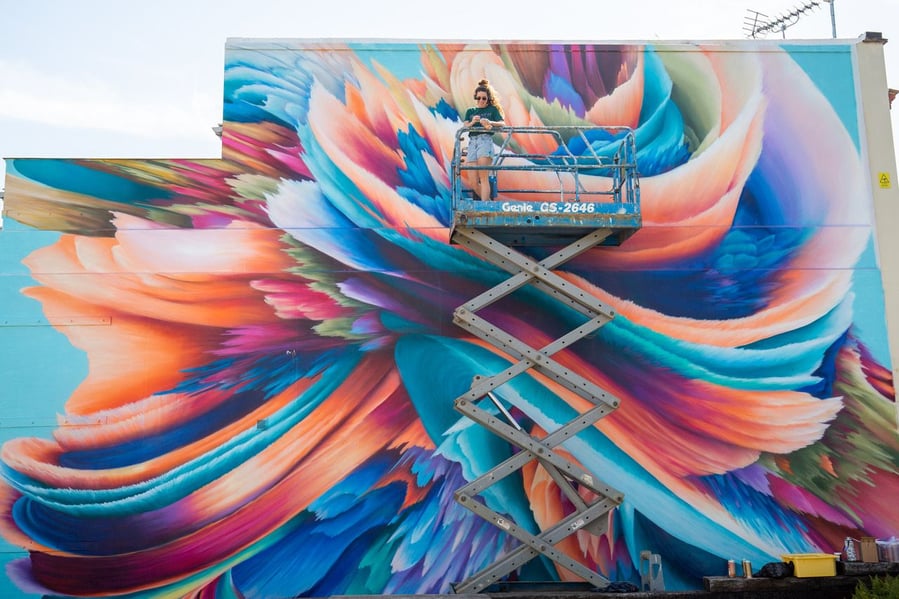 London-based street artist Rosie Woods hard at work on one of her gorgeous murals.  