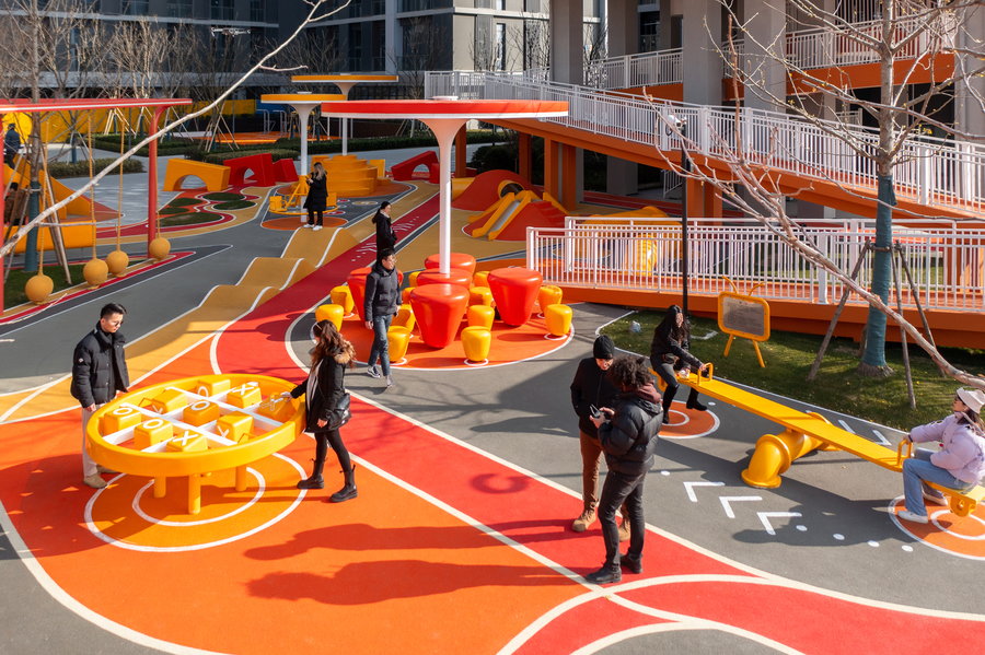 People interact with fun games and obstacles around the Magma Flow Park in Ningbo.