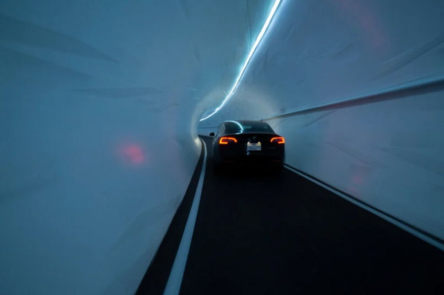 Tesla vehicle zips through an underground tunnel built by Elon Musk's the Boring Company. 