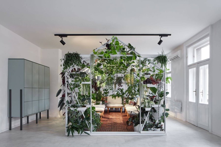 The inside of the greenhouse hosts tranquil meeting spaces and lounges.