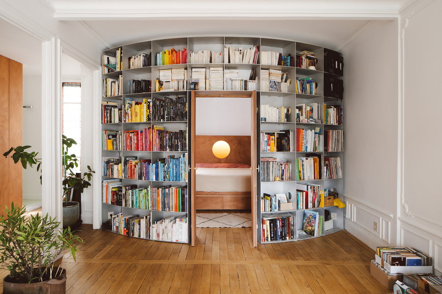 This large curving bookcase is one of the centerpieces of Jean Benoit Vétillard's Gambetta Paris apartment renovation.
