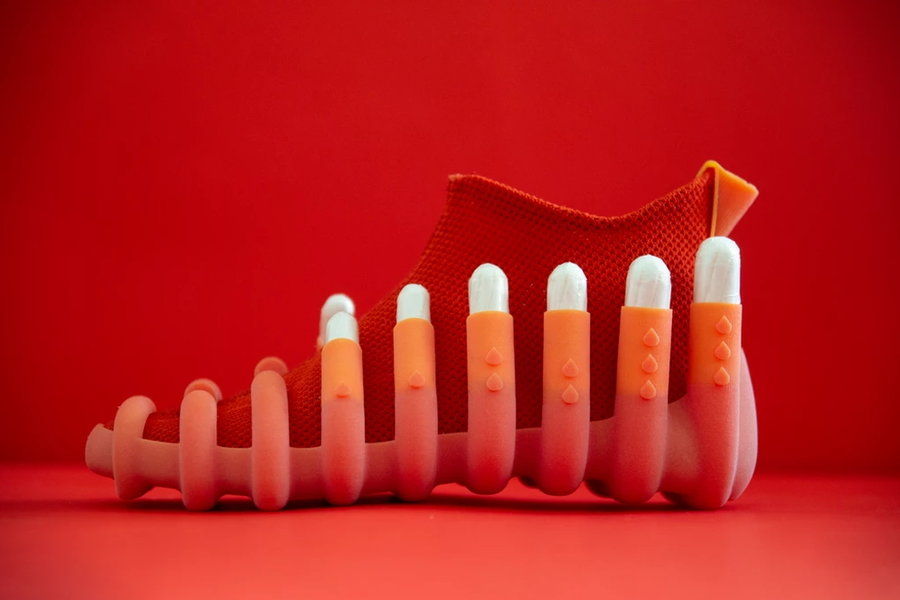 This quirky red shoe featured in Netha Goldberg's NETINA collection features 12 ports for different-sized tampons.