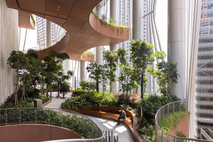 Lush green garden space inside Singapore's biophilic CapitaSpring skyscraper.