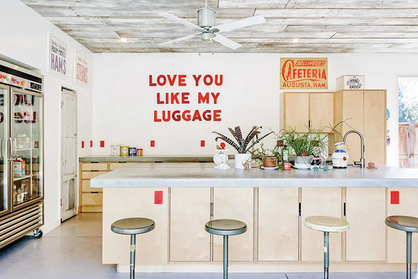 The kitchen area inside the shipping container home is all about simplicity, with the occasional quirky decor piece standing out here and there.