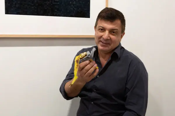 Performance artist David Datuna eats the $120,000 banana art 