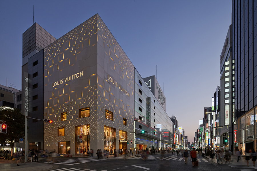 The exterior of Tokyo's Louis Vuitton Matsuya Ginza glows softly in the twilight.