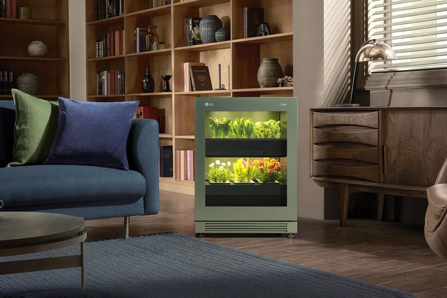 The compact LG Tiiun smart gardening appliance in a contemporary living room.