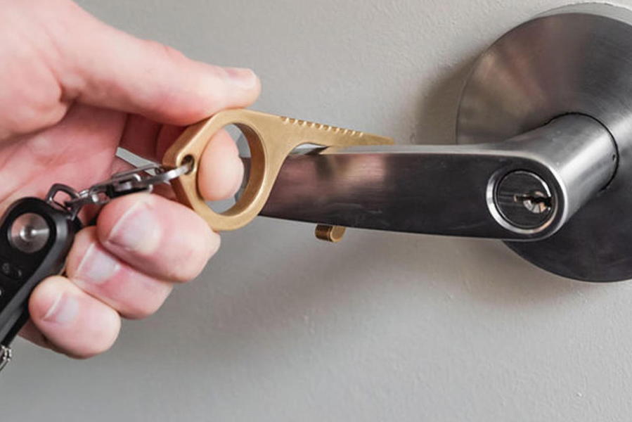 The CleanKey hands-free door opening tool .