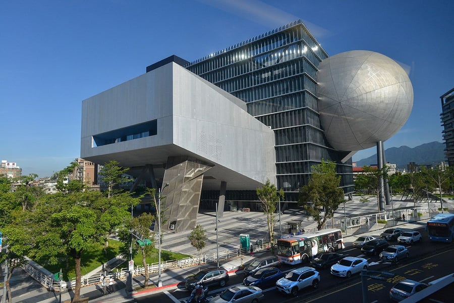 Large geometric shapes fuse into a center cube at OMA's Taipei Performing Arts Center in Taiwan.