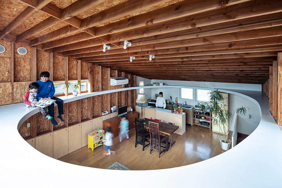 By working a large elliptical cutout into this otherwise tiny Tokyo home, mtka has created a whole new level of space.