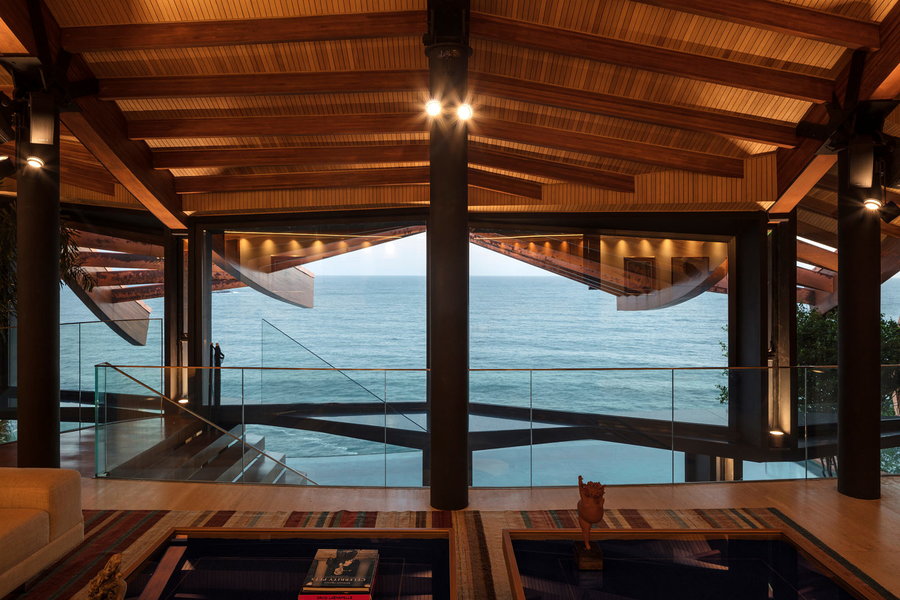 Views of the sea from inside the sculptural wooden Wave House