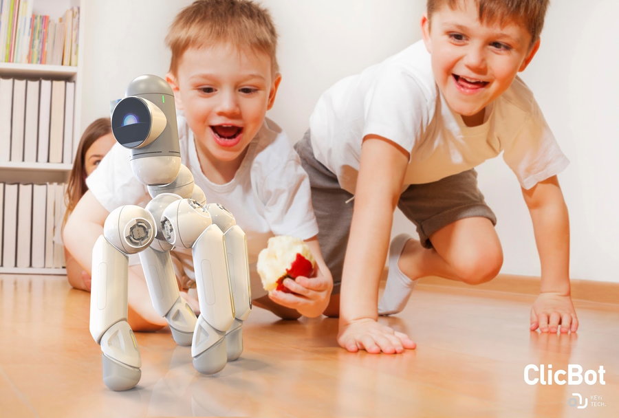 Two adorable little boys have a blast while playing with their Clicbot educational robot.