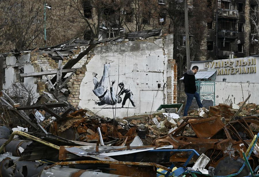 Banksy mural in Borodyanka, Ukraine shows a man resembling Russian president Vladimir Putin being thrown to the ground during a judo match with a young boy.