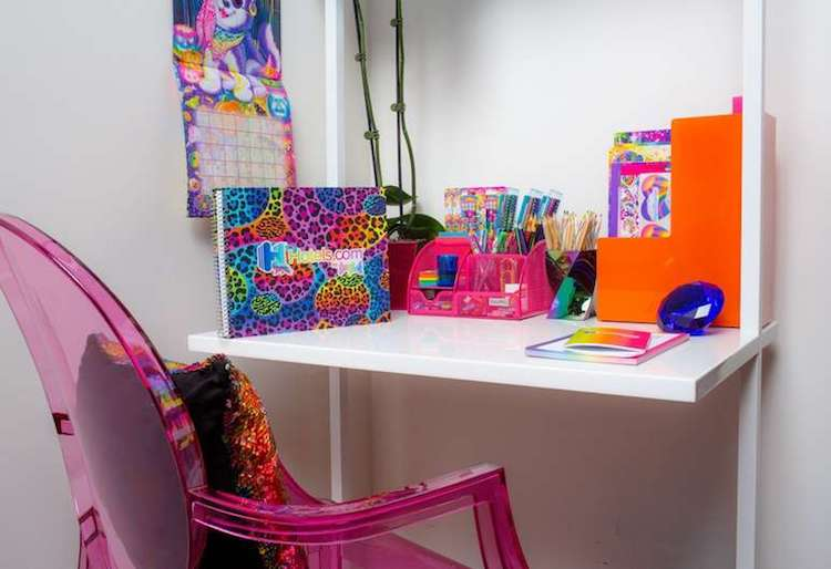 A desk inside the Lisa Frank Flat houses the designer's iconic school supplies