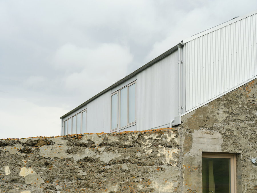 Close-up exterior view of the old-meets-modern Icelandic barn renovated by Studio Bua.