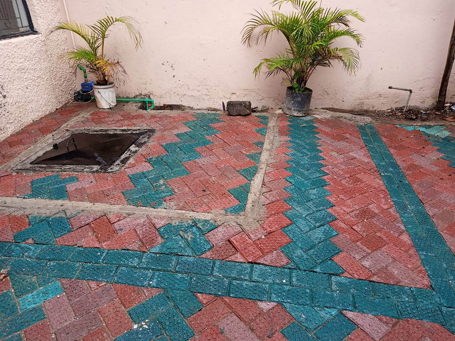Different shades of Nzambi Matee's recycled bricks adorn this Kenyan patio/courtyard.