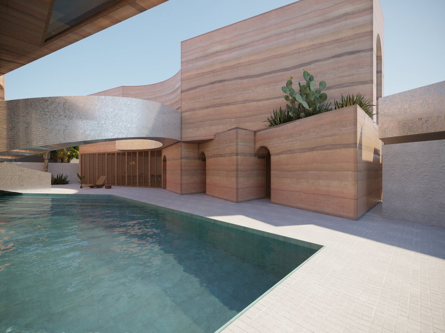 The rammed earth house's central courtyard boasts a beautiful swimming pool and shimmering spiral staircase. 