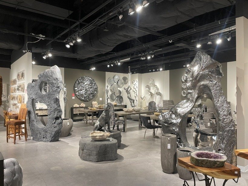 Abstract silver sculptures adorn the Phillips Collection showroom at Las Vegas Market.