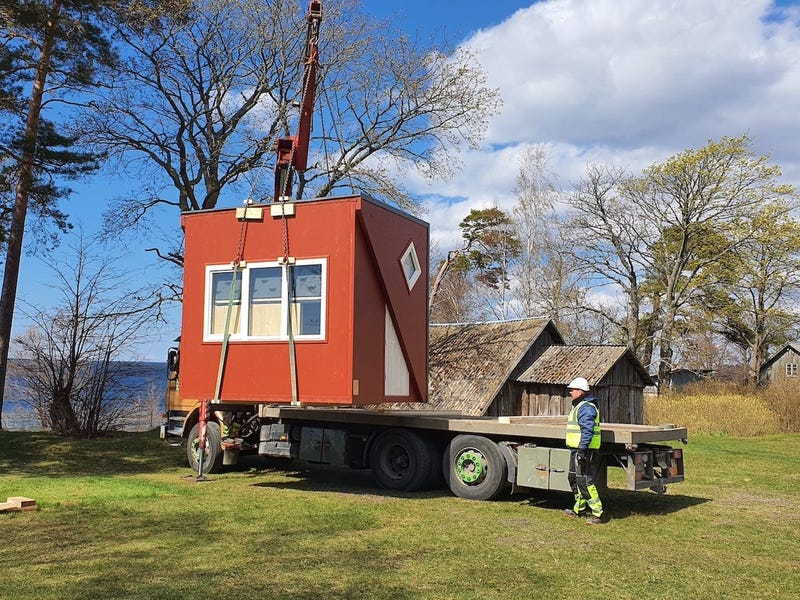 A Brette Haus tiny home being transported on a trailer.