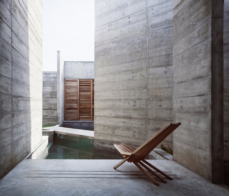 A narrow swimming pool allows the Zicatela House's inhabitants to swim through the concrete walls with ease.
