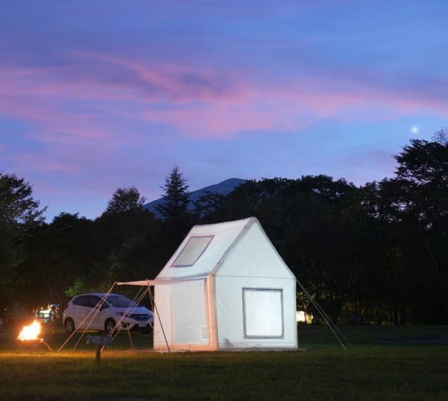 Air Architecture's white inflatable tent resembles a classic gabled house for a homey feeling you can take absolutely anywhere.