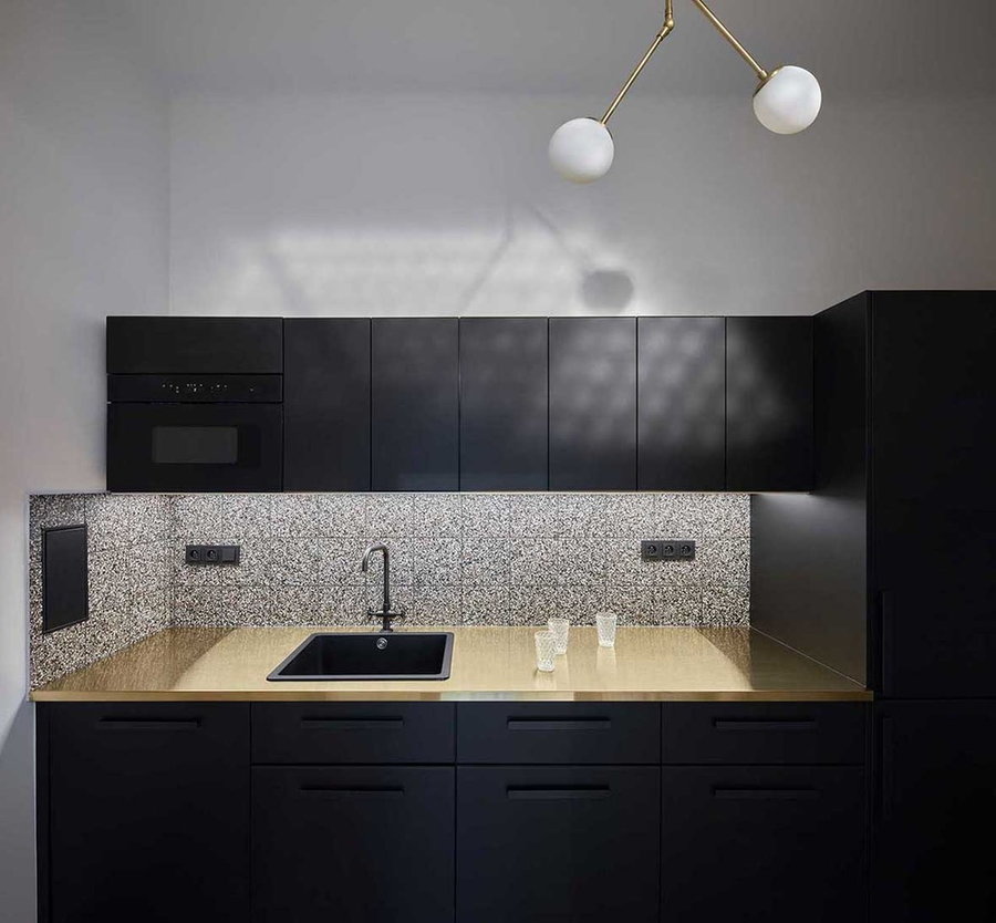 Sleek minimalist kitchen space at the Tomas Cisar-designed Poetizer offices in Prague. 