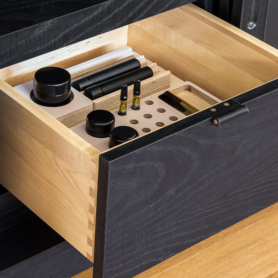 Vapes, flower jars, and pre-rolls are all neatly organized within Forti Goods' modern cabinets and credenzas.