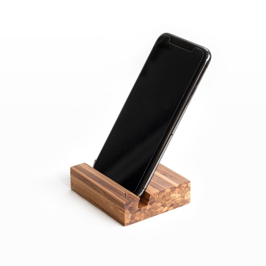 A simple wooden smartphone stand made from recycled chopsticks.