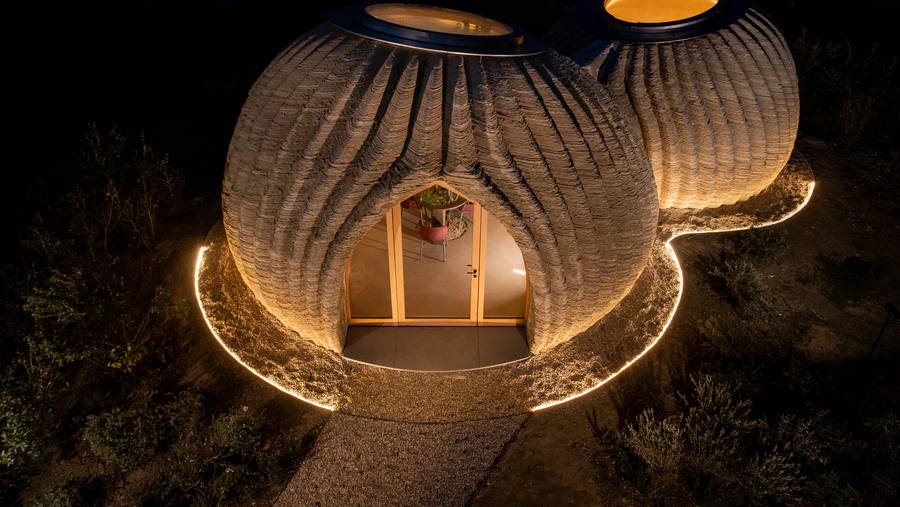 Exterior view of TECLA, a super sustainable 3d-printed house made from locally-sourced raw earth.