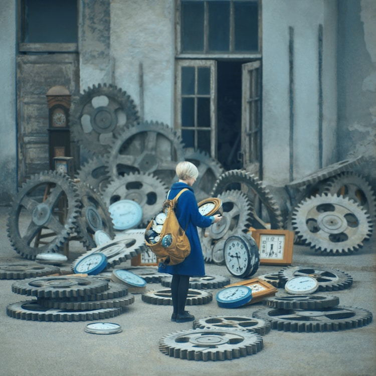 Surreal photograph by Ukrainian artist Oleg Oprisco shows a woman rummaging through giant gears and cogs. 
