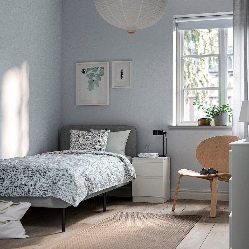 IKEA's compact SLATTUM Bed in a cozy gray bedroom.