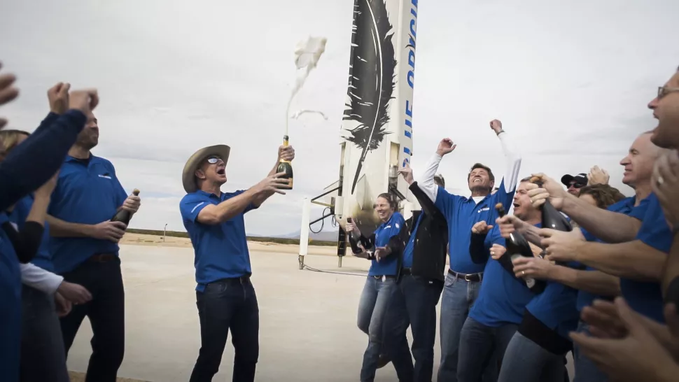 Jeff Bezos and co. pop open champagne bottles to celebrate their record-setting trip to space.