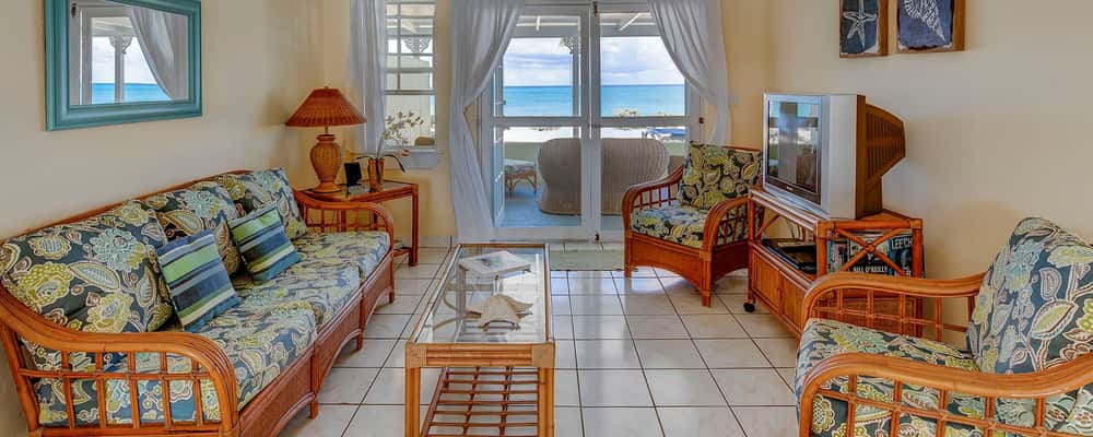 Living room that opens to the units private veranda and the sea right outside the door.