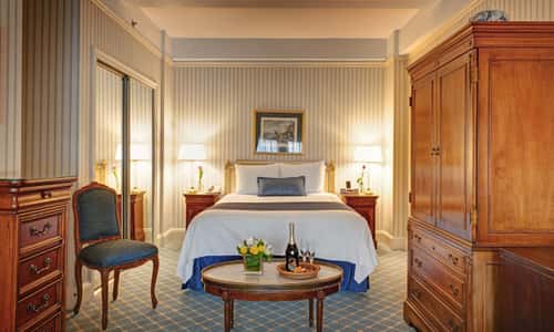 Deluxe Queen room with queen bed and is approximately 300 square feet at Hotel Elysee by Library Hotel Collection.