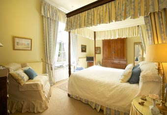 Four poster king sized bedroom downstairs in the wing