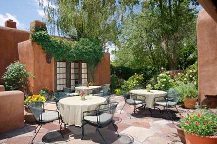 The enclosed garden patio is the perfect spot for breakfast during much of the year - aromatic roses, chirping birds, and Santa Fe's perpetual sun and blue skies.