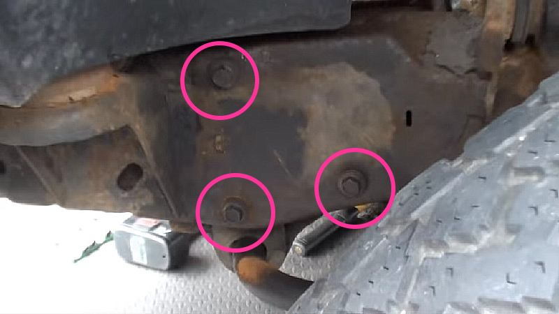 Three bolts hold power steering gear box to frame