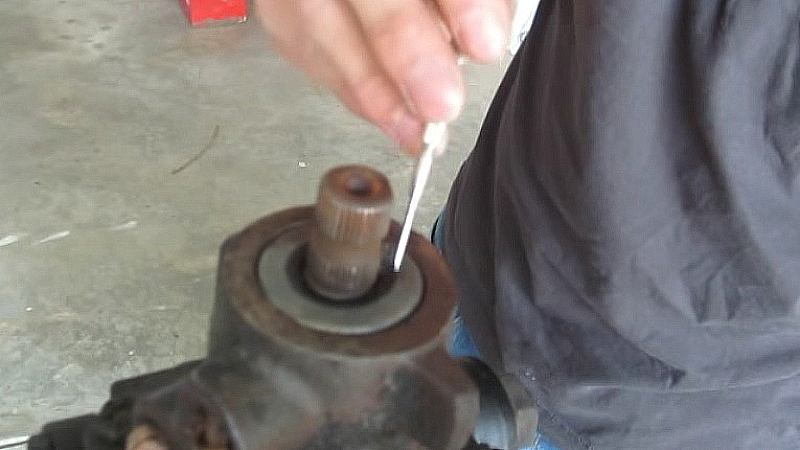Pry the nylon end cap out of the input shaft seal