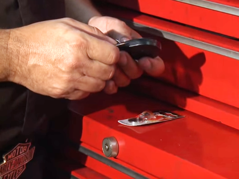 The proximity security system key fob can be opened with a dime