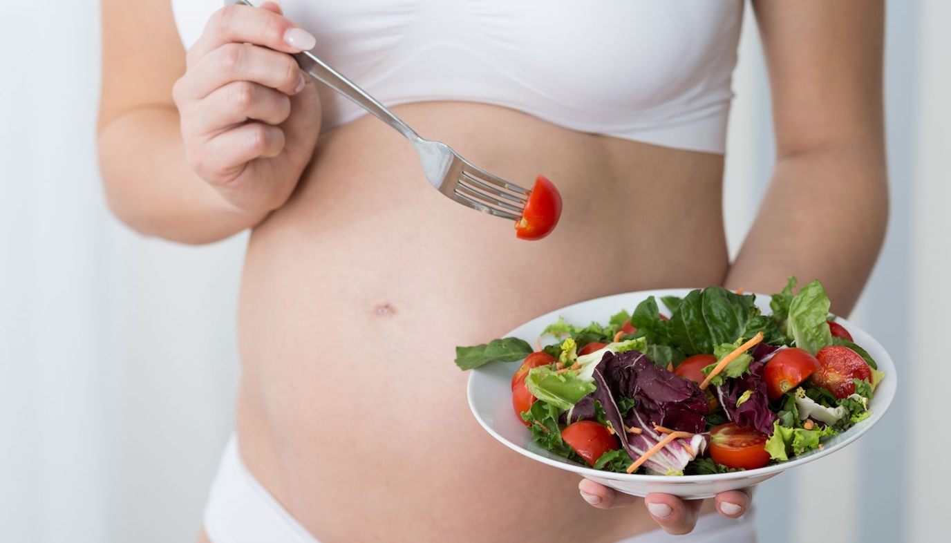 pregnant mom eating a salad