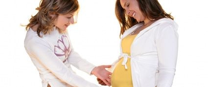 woman exclaiming over pregnant belly everyone is pregnant but me how to cope with feelings of jealousy