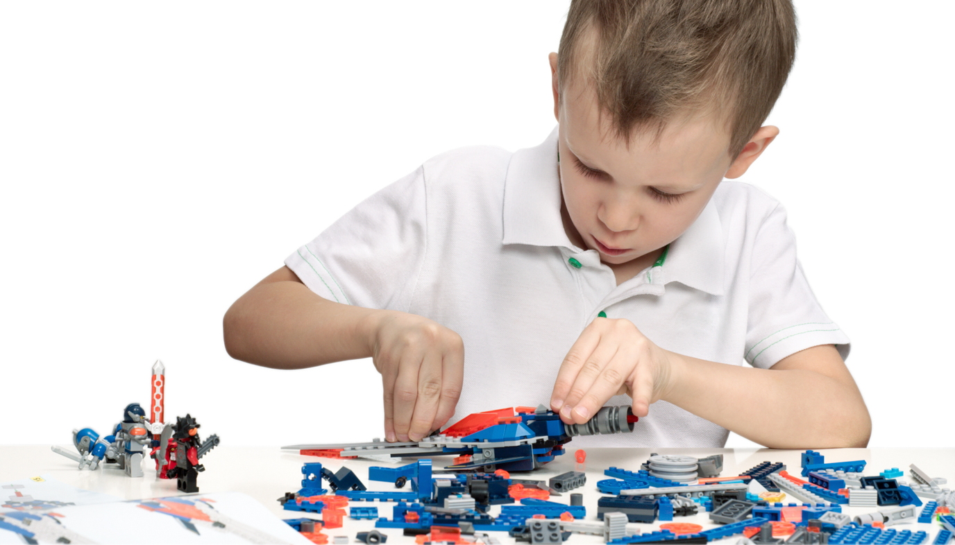 boy playing with construction set