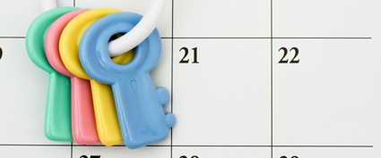 A ring of plastic keys against a calendar.