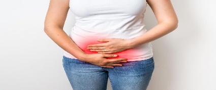 A woman with hands on her abdomen and a red pain indicator.