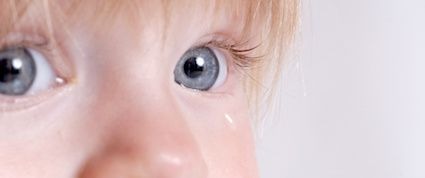 child with teary eye