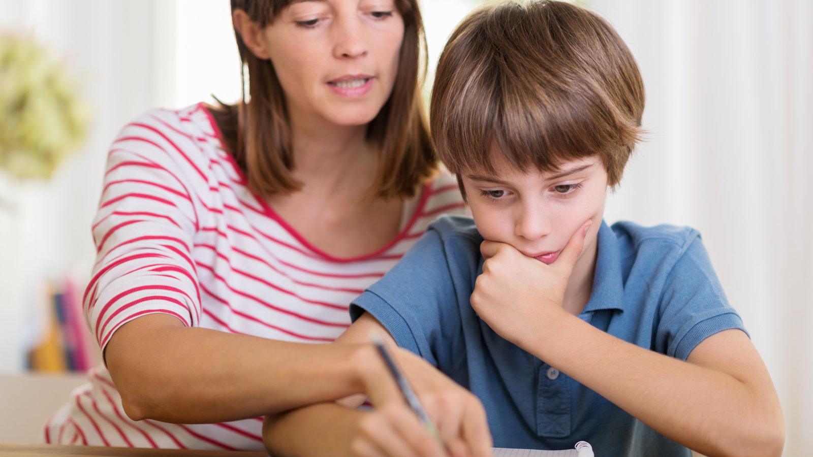 mom helping son with homework