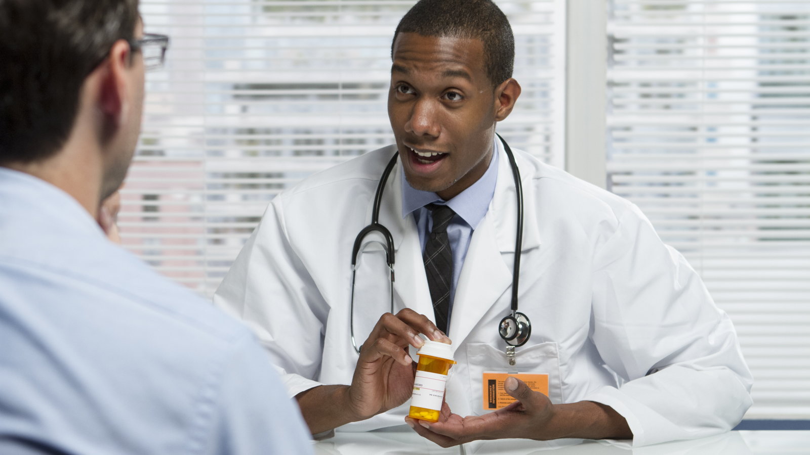 doctor talking to man about prescription